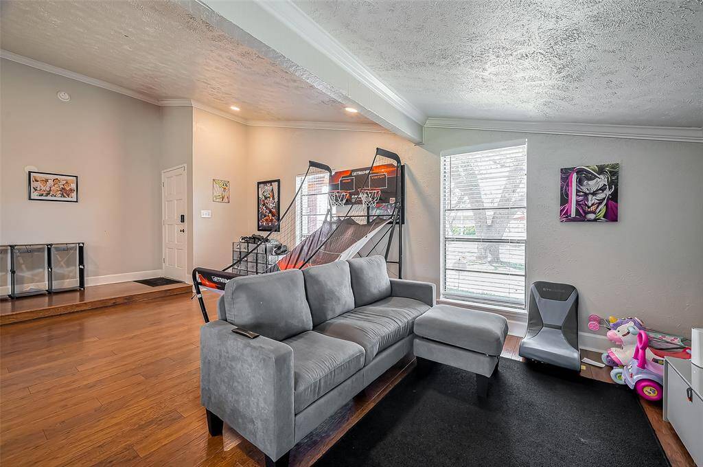 Another view of the formal living area which is currently being used as a gameroom/playroom. This would also be a great space for a home office