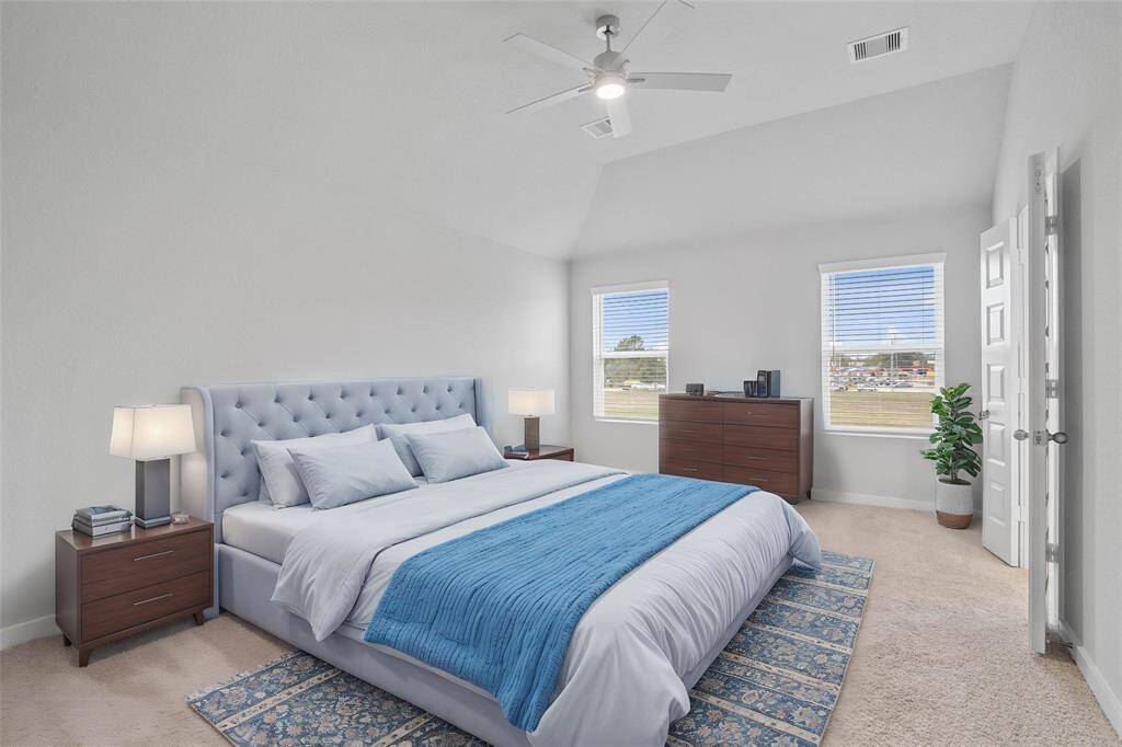 Come and unwind after a long day in this magnificent primary suite! This spacious room features plush carpet, warm paint, high ceilings with ceiling fan, and large windows with privacy blinds!