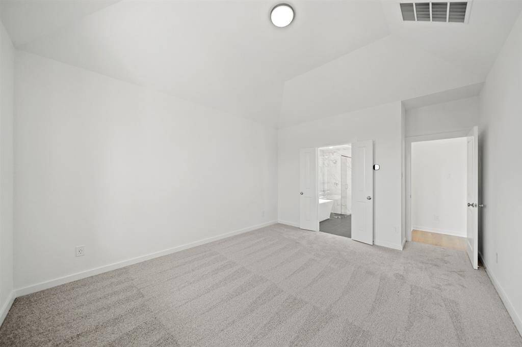 The open-concept family room allows easy flow into dining and kitchen areas for effortless daily living or hosting gatherings with family and friends.