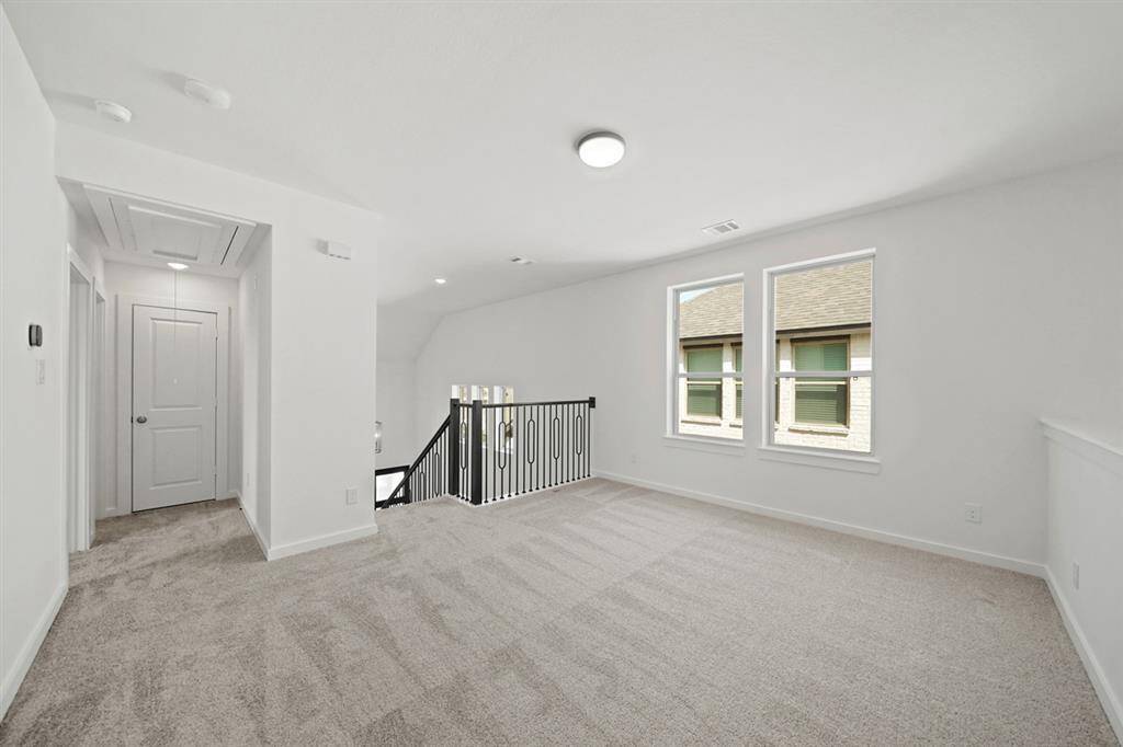 Unwind in your new luxurious primary bath, featuring beautiful free standing tub and separate glass-enclosed shower with floor to ceiling tile accents.
