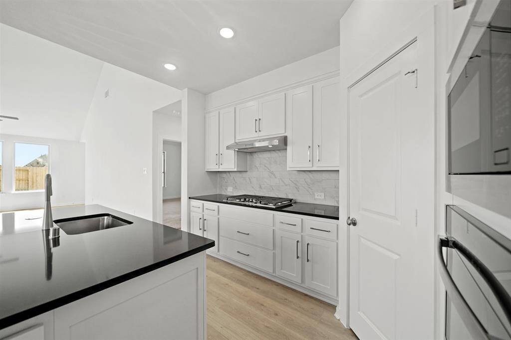 Soaring 20ft ceilings in grand entryway welcome guests with dramatic and unforgettable first impression.