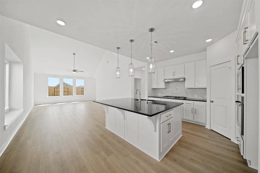 You are greeted by the amazing flow of this home, starting from the grand entryway, into the kitchen, and leading up to the family room
