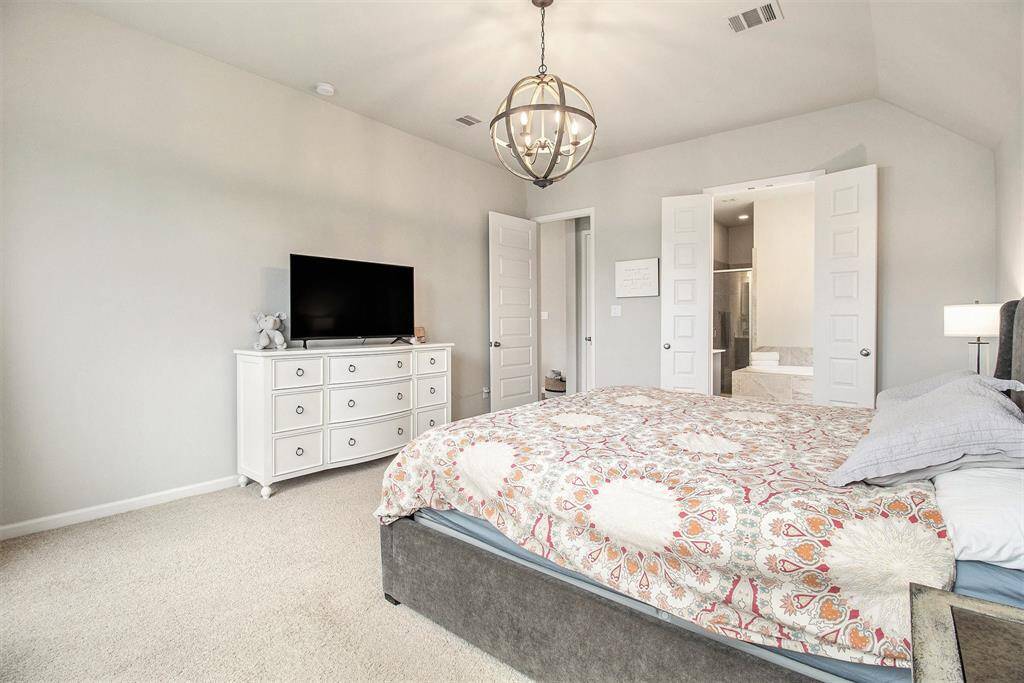 Wow! A beautiful primary bedroom area with stunning windows