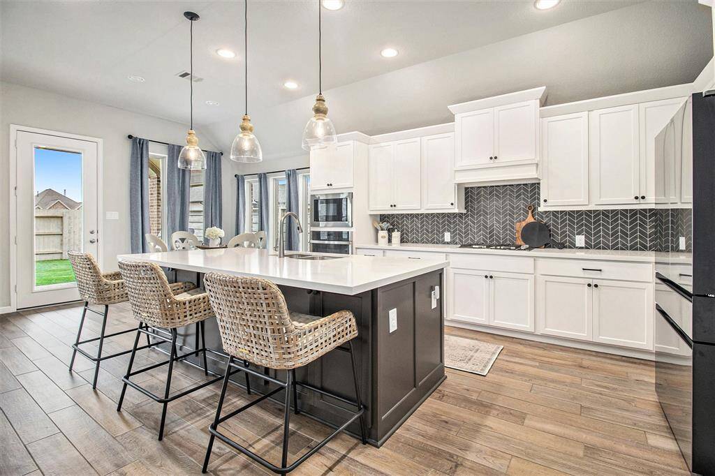 A place to call home! Beautiful open living area/kitchen floor plan with many extra touches throughout this well maintained home.