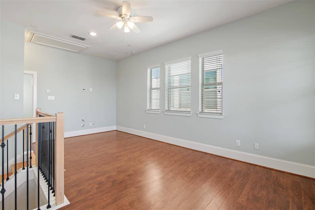 Generous sized game/media room located on the fourth floor with plenty of room for a pool table! There is also another bedroom with an en suite bathroom through the door in the back. Note the attic access that has some flooring for extra storage.