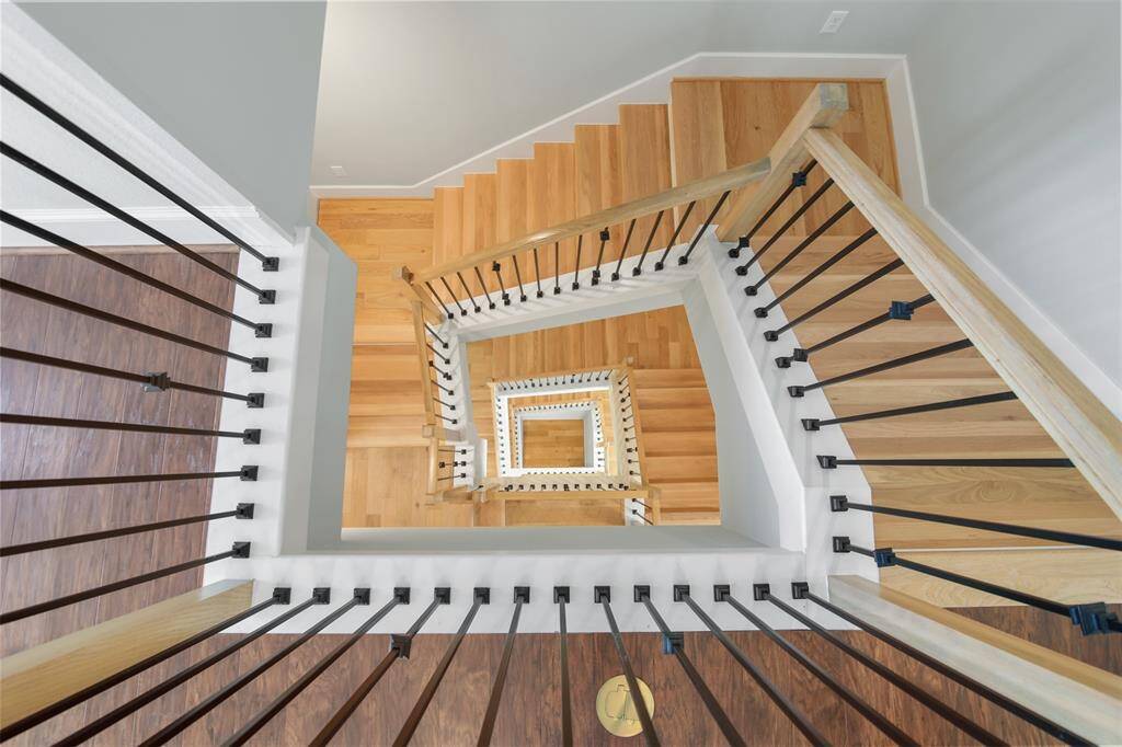 Beautiful shot of the modern stairwell!  This is where the elevator would go if you want to install one to skip the stairs.