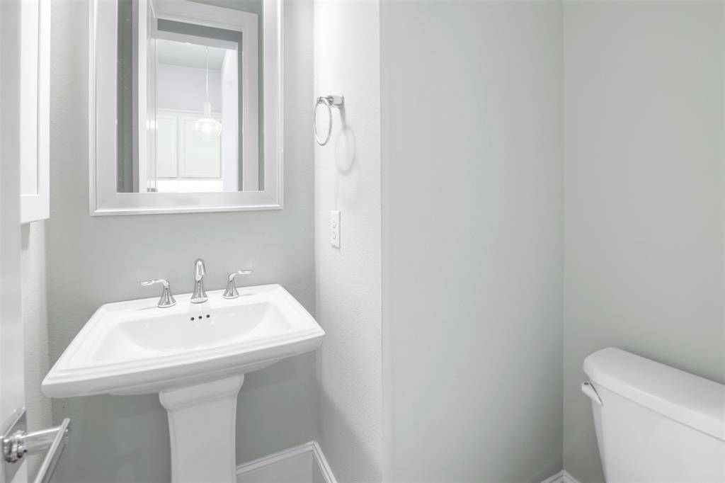 Powder room is located on the second floor in the open concept living/dining/kitchen area.
