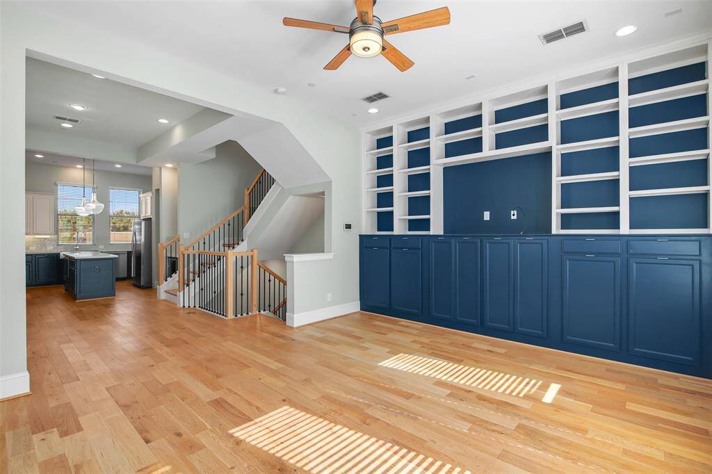 View from opposite side of family room showcasing the open concept living space that includes the dining area and kitchen. This is a perfect set up for entertaining friends and family.