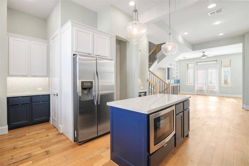 A view of the kitchen showing the built in microwave and also the little nook that would be a perfect spot for a coffee bar.