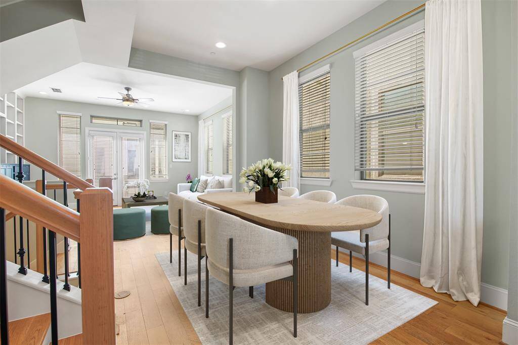 Virtually staged dining area which opens to the family room and kitchen.