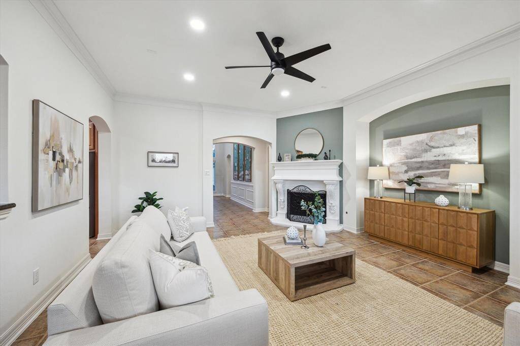The family room is conveniently accessible from both the kitchen and the entry, perfect for entertaining, family gatherings, or enjoying peaceful moments while overlooking the serene lakefront. The primary suite is tucked away down the hall just past the family room.