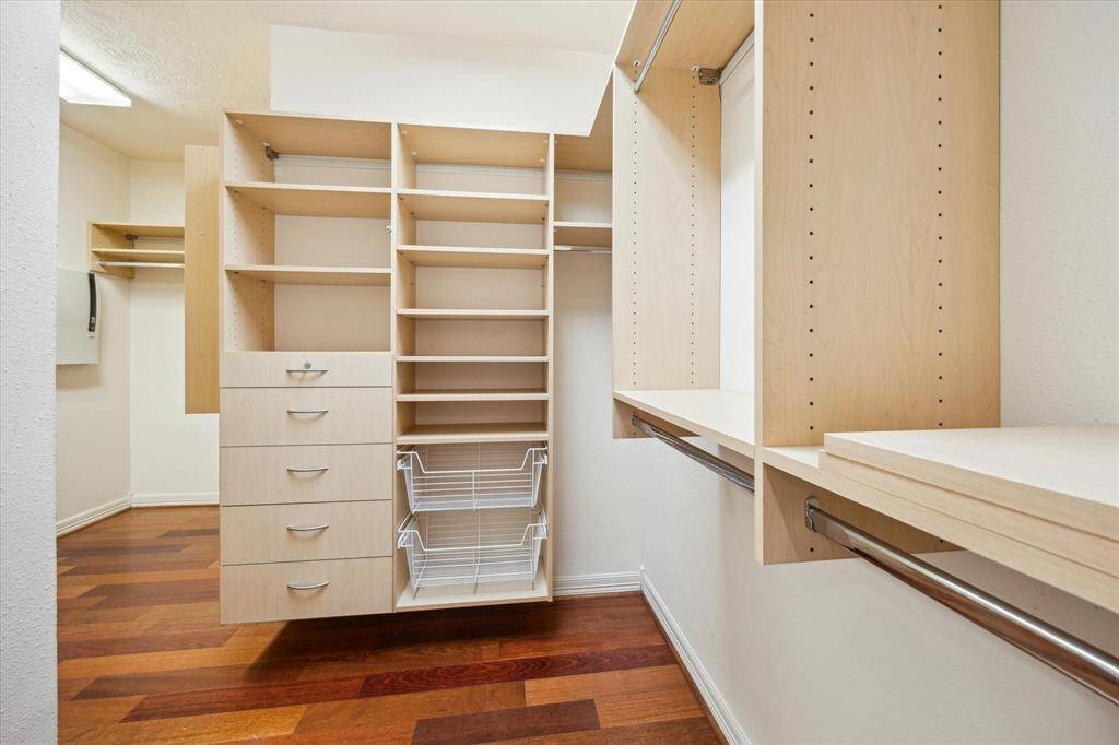 With ample storage for clothing and accessories, this walk-in closet ensures everything has its place, offering both functionality and style for the ultimate storage solution.