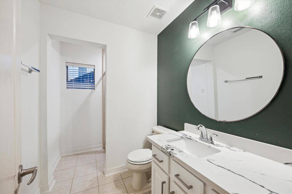 The secondary bathroom upstairs has been beautifully updated.