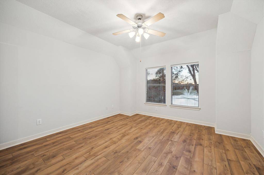 The three spacious secondary bedrooms upstairs feature  low maintenance wood-look flooring.