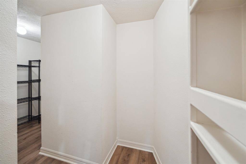 Discover the hidden secret room, tucked away behind a built-in shelf for ultimate privacy. This is a spacious storage room or the possibility of another room to fit your needs.