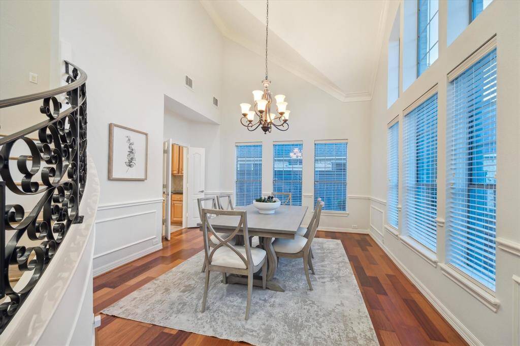 The two-story dining room offers the perfect setting for formal gatherings, with a spacious layout. Conveniently located with easy access to the kitchen through the butler’s pantry.