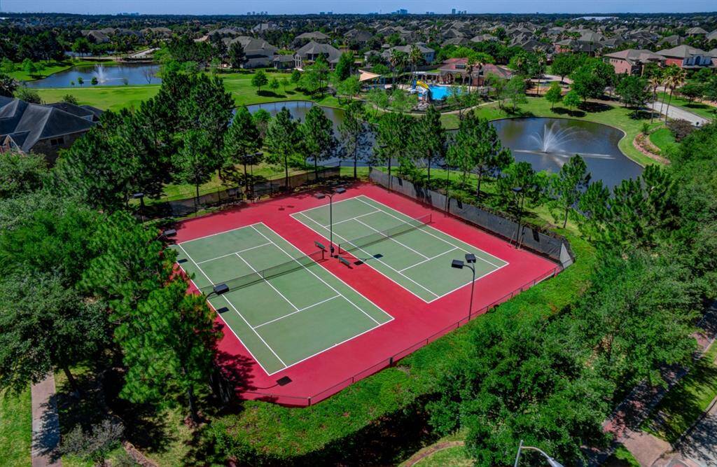 This tennis court and pickle ball court are steps away from the property.