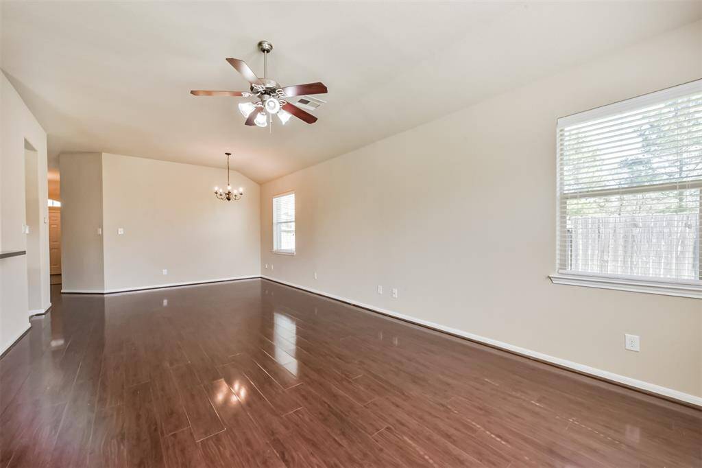 Family room with ceiling fan.