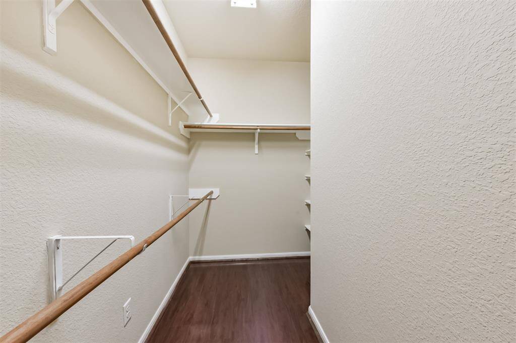Spacious walk-in closet for all your wardrobe needs.