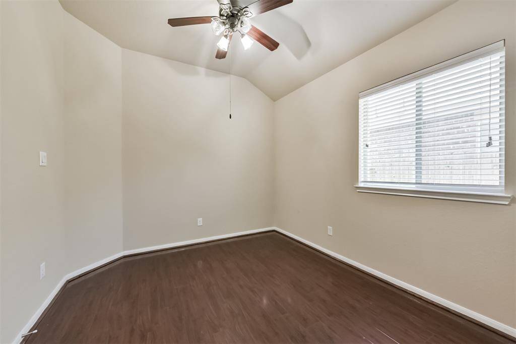 Versatile room with abundant natural light, perfect for an office, playroom, or guest space.