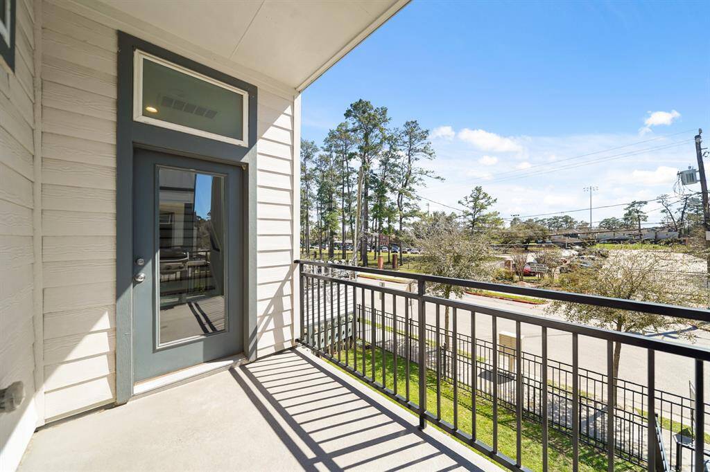 The 12' covered patio with recessed lighting and surrounded by wrought iron railing overlooks the front of the home and is perfect for outdoor furniture, a barbecue grill, etc. Included is an electrical outlet & natural gas connection.