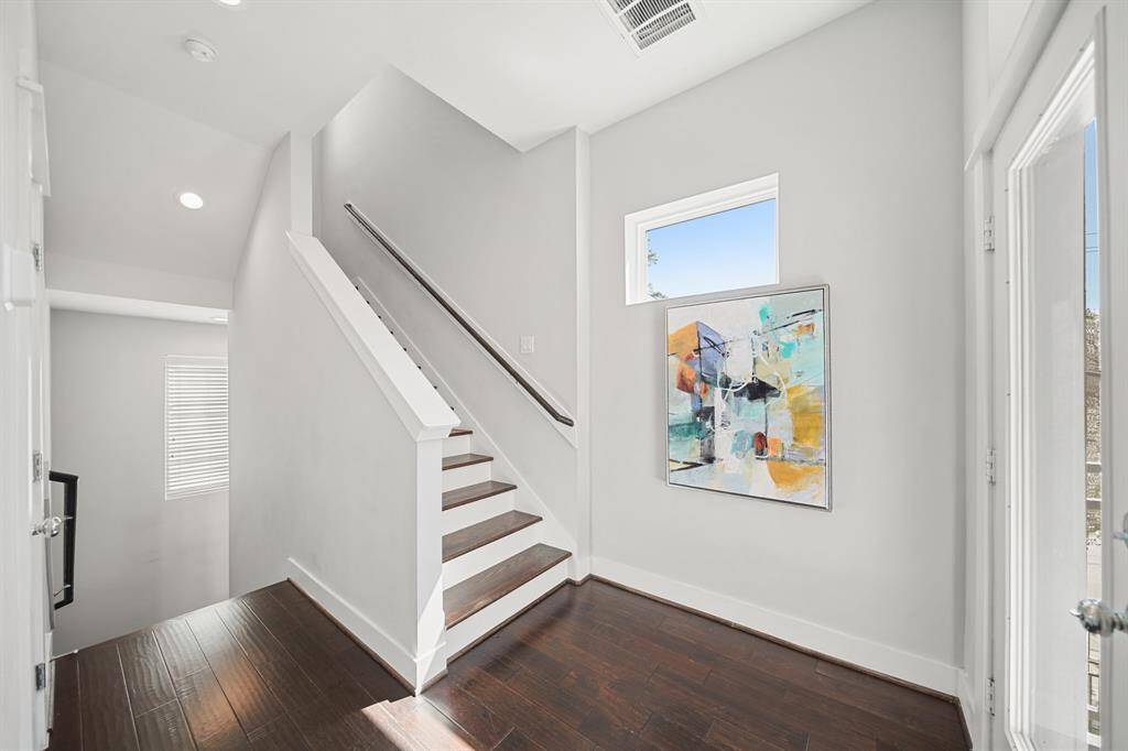 A view of the staircase leading to the third level of the home.
