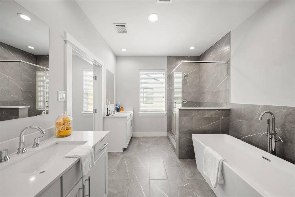 Additional features include a linen storage closet, private water closet & 12" x 24" tile flooring.
