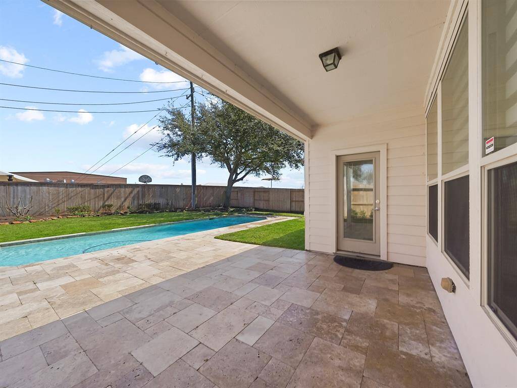 tep outside and discover your own private paradise – a covered patio, sparkling pool, and ample green space await. The covered patio is perfect for outdoor durniture and grill!