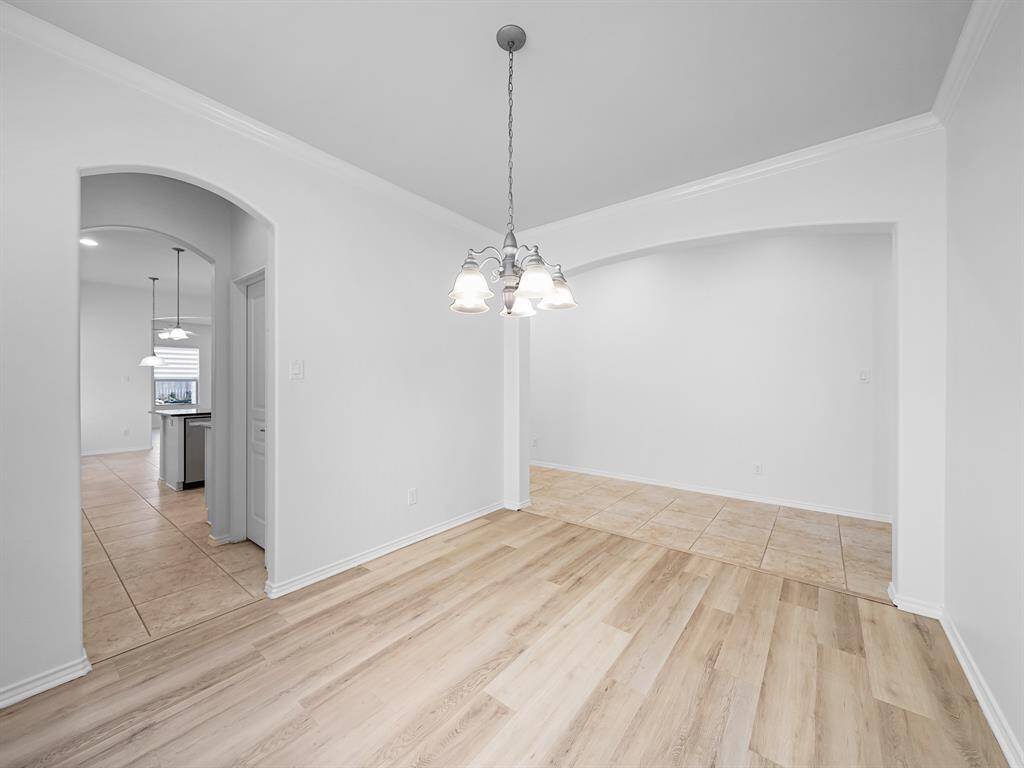 The expansive formal dining room is perfect for hosting gatherings and creating lasting memories.