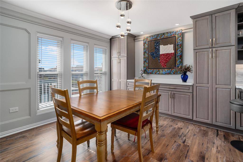 The kitchen renovation included plenty of storage and pantries extending into the dining room.  The dining room windows overlooks the canal.