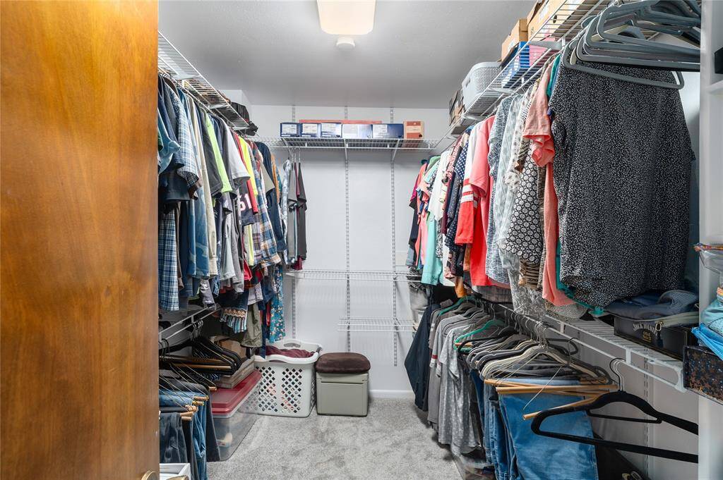 large primary bedroom walk-in closet