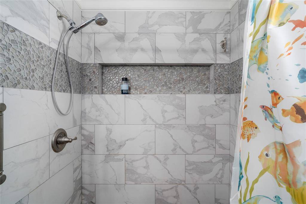 Walk-in shower in the primary bathroom.