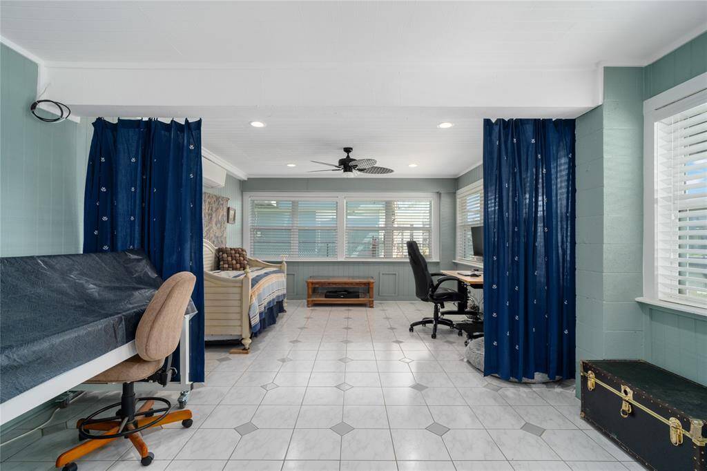 This end of the downstairs den, the curtains can be pulled for privacy for extra overnight guests.
