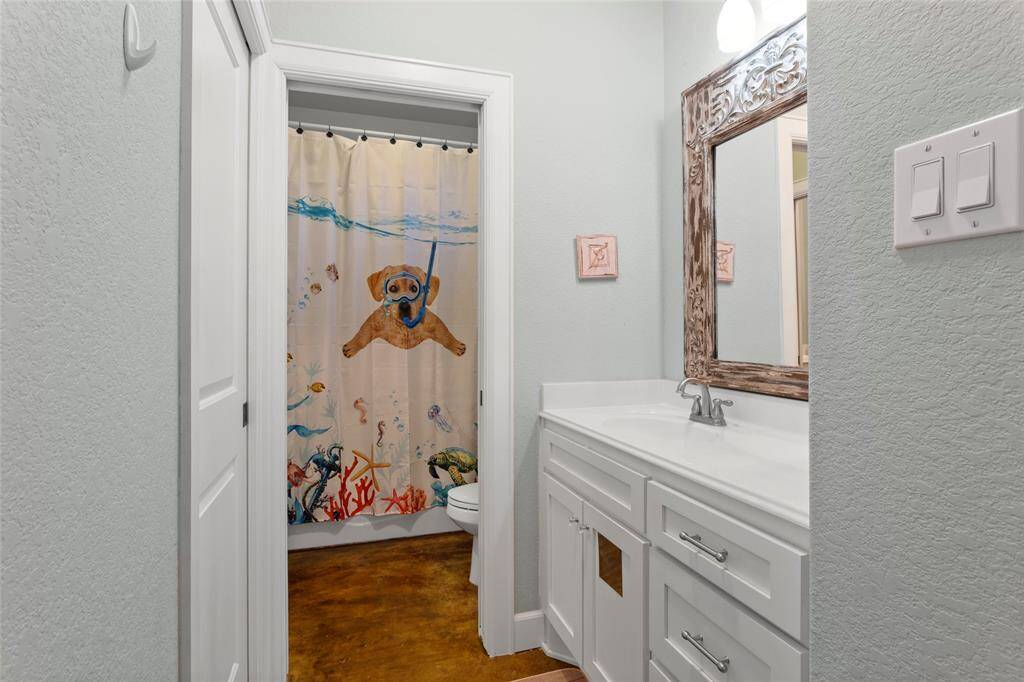 This single vanity is connected to Bedroom #2 and shares a Hollywood bathroom with Bedroom #3.  To the left is a pocket door with a walk-in closet.