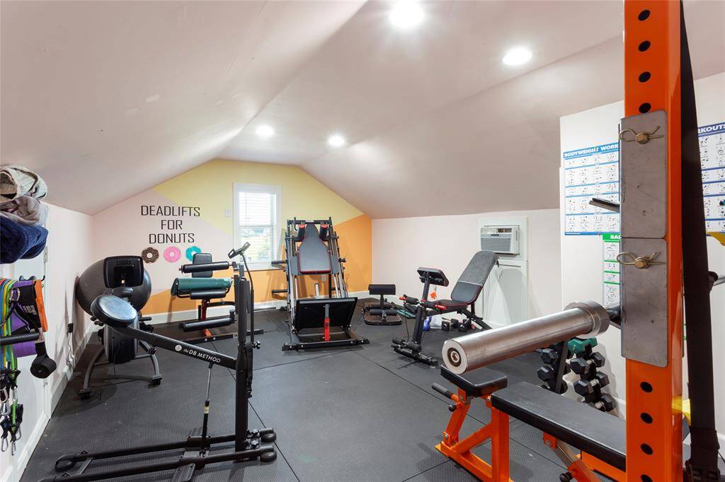 Upstairs you'll find the perfect home gym featuring bright lighting, and motivational wall decor, and an inviting workout space. A wall mounted A/C was installed for those hot summer months.