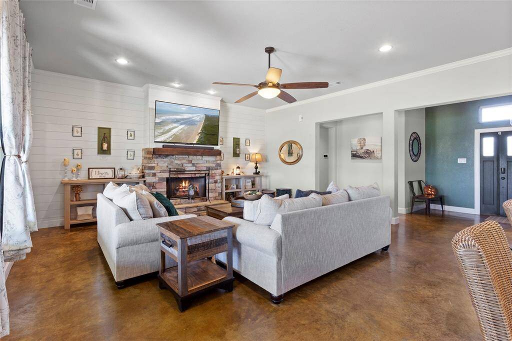 The living room is modern yet comfortable.  As you walk through the front door, you're instantly greeted with this beautiful, open space.  Dimmable recessed lighting allows you to set the perfect mood.