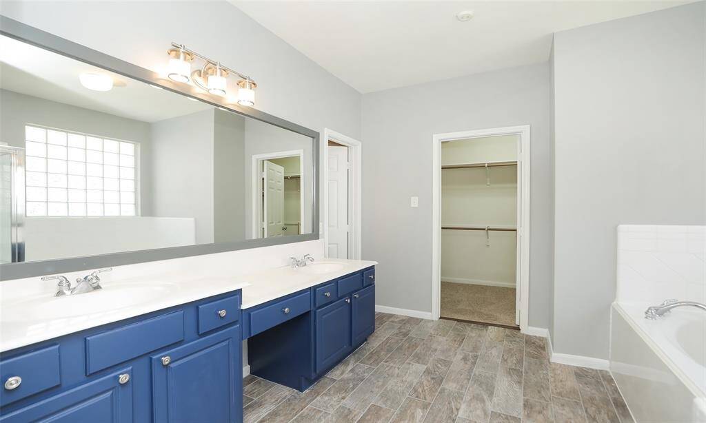 Primary Bathroom with double sinks and vanity