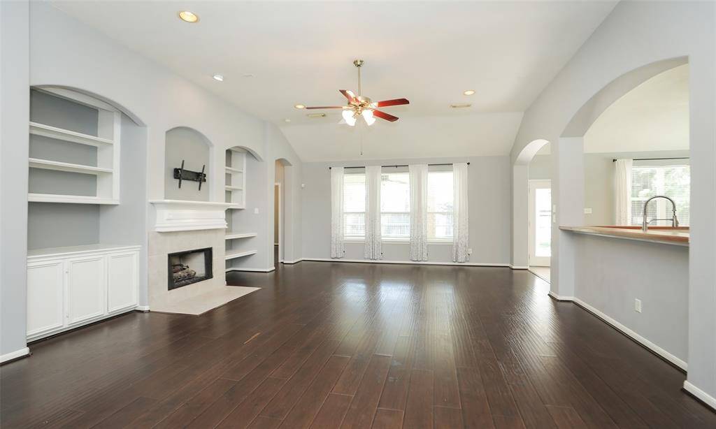 Spacious Living area with fireplace and built-ins