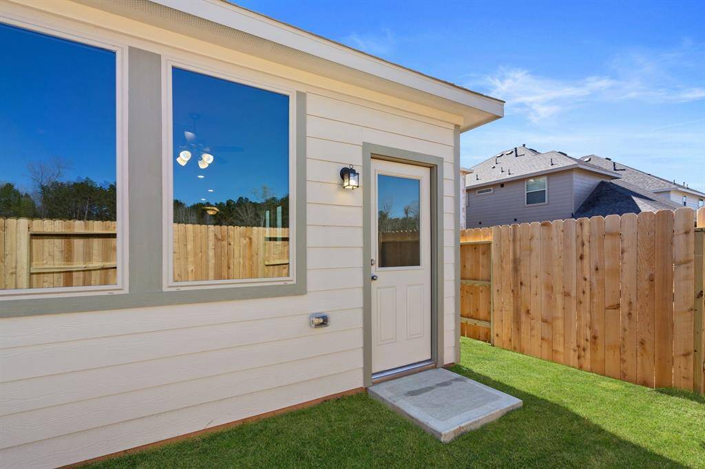 The backyard is generously sized, providing ample space for various outdoor activities.