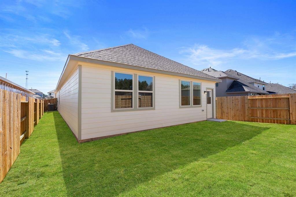 This backyard is perfect for family gatherings, social events, or simply unwinding in the fresh air.