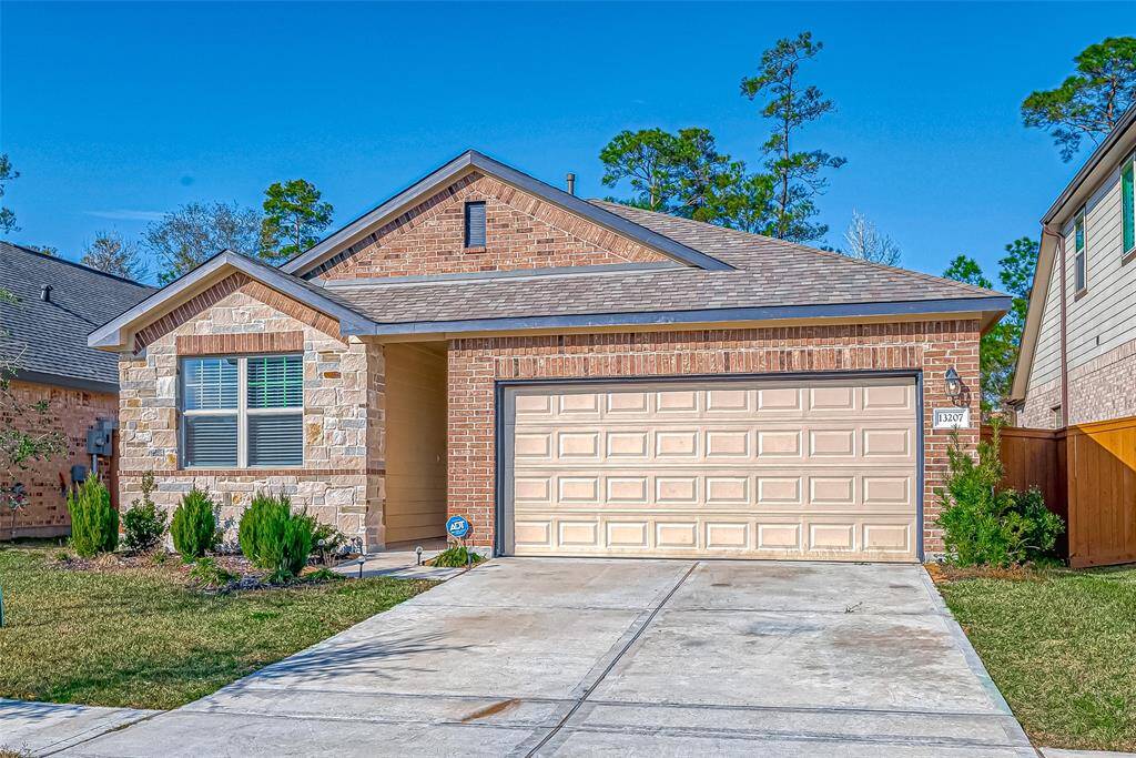 Double wide driveway and two car garage