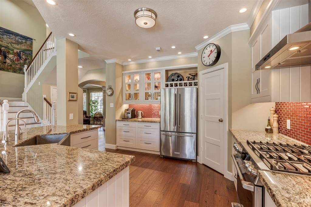 Plenty of space for everything. A walk in pantry, lots of drawers and cabinets, granite counters for workspace, and beautiful glass front cabinets for display pieces. There is a microwave drawer that has an outlet. The owners never put in the microwave but the space is there.