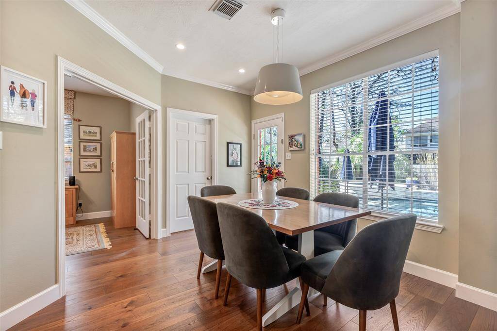 What a view from the breakfast area. This spot overlooks the inviting pool and spa. On the other side of the shut door is the laundry room.