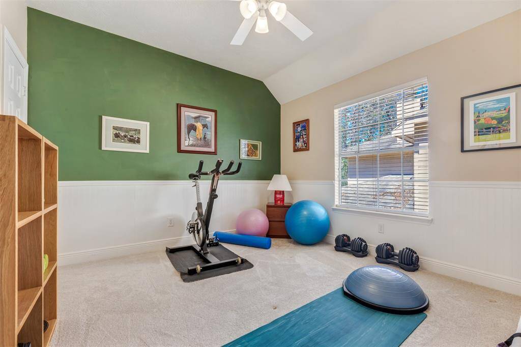 This large 5 bedroom home has room for everything. This bedroom is currently being used as an exercise room.
