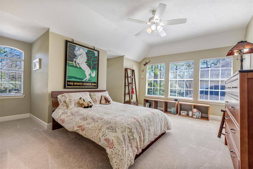 This large bedroom with fun dormers can accommodate any size bed and a sitting area. This spacious room would be a nice space as a guest suite. It's also ensuite with an updated bathroom.