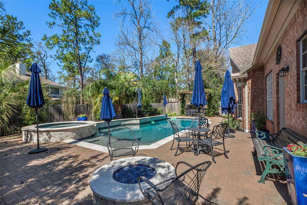 This renovated backyard is paradise. It contains a heated saltwater pool, spa, gas firepit with crushed glass, and pergola.There's a removable pool fence and gate that can be installed. New holes would need to be drilled into the pool deck.