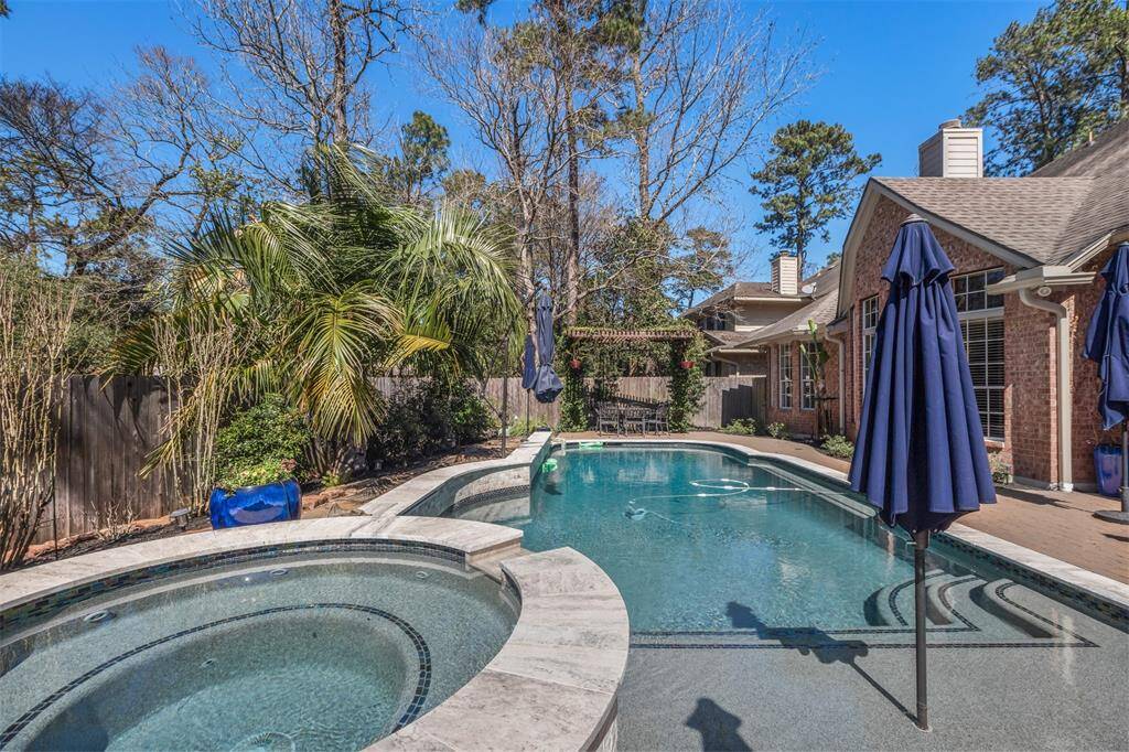 The pool deck/patio is made from Belgard pavers. The pool coping is Travertine pavers, The water line tile has glass accent tiles. The pool surface is PebbleTec.