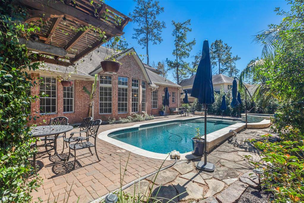 The backyard is a quiet oasis with a privacy fence and professional landscaping. A great spot for all your summertime fun!