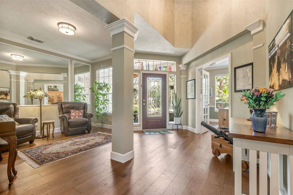 Another view of the front entry from a different location. The room with the French doors is the first home office.