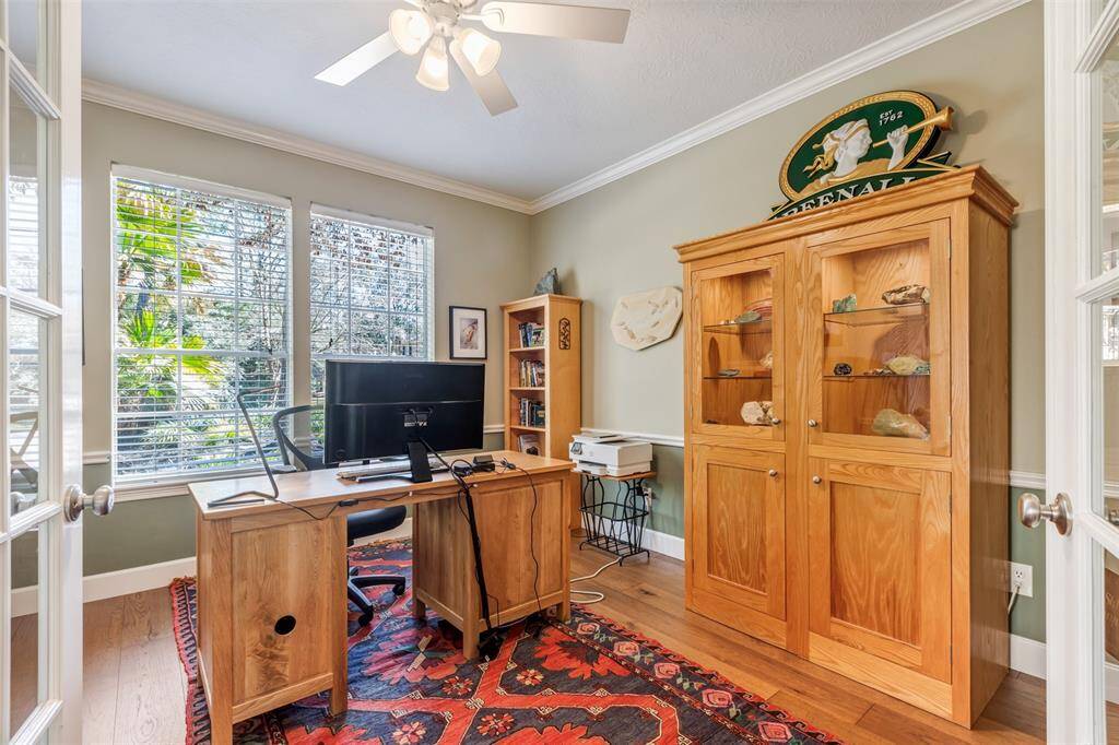This home is perfect for those who work from home. It has two home offices, this one is off the entry. The pretty hickory floors continue into this room. French doors are perfect for privacy.
